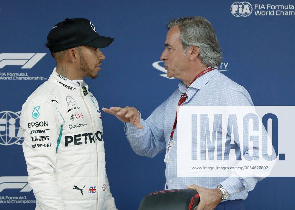 British F-1 driver Lewis Hamilton (L), of Mercedes GP team, chats with Spanish rally driver Carlos Sainz (R) after winning the pole position after the qualifying session for F-1 Spain GP race at Circuito de Barcelona-Cataluna circuit in Montmelo, outside Barcelona, Spain, 12 May 2018. The race will be held on 13 May 2018. Qualifying session for F-1 Spain GP race !ACHTUNG: NUR REDAKTIONELLE NUTZUNG!
