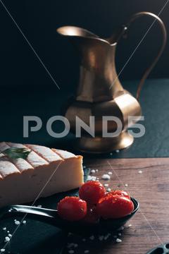A closeup of the traditional French Brie cheese with fresh tomatoes closeup, traditional, French, Brie, cheese, tomatoes, food, fresh, france, cheesy, tomato, appetizer, dairy, sliced, piece, delicious, product, tasty, snack, appetizing, delicatessen, copper, jug