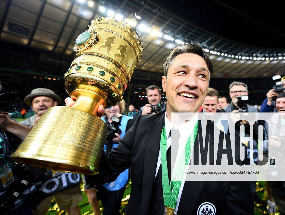 DFB Cup final Men FC Bayern Muenchen Eintracht Frankfurt v l Coach Niko Kovac Eintracht Frankfurt cheers cheering with the DFB Pokal after the end of the game over the cup victory Berlin
