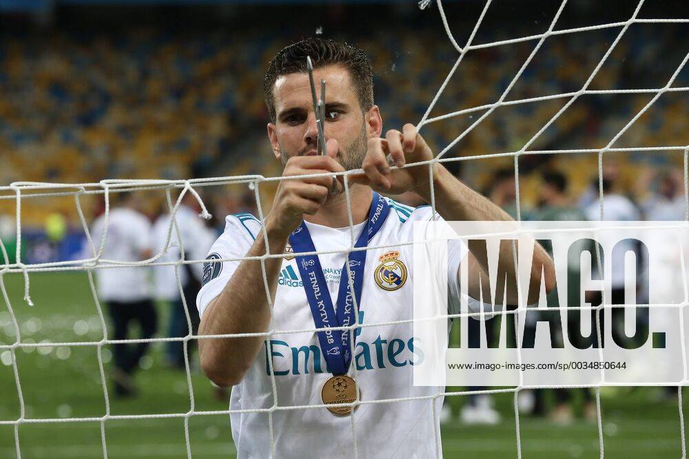 Real Madrid v Liverpool UEFA Champions League Final Nacho Fernandez of Real Madrid cuts the net at the end of the UEFA Champions League Final at the Olympic Stadium, Kiev Content Not Available For UK Newspapers