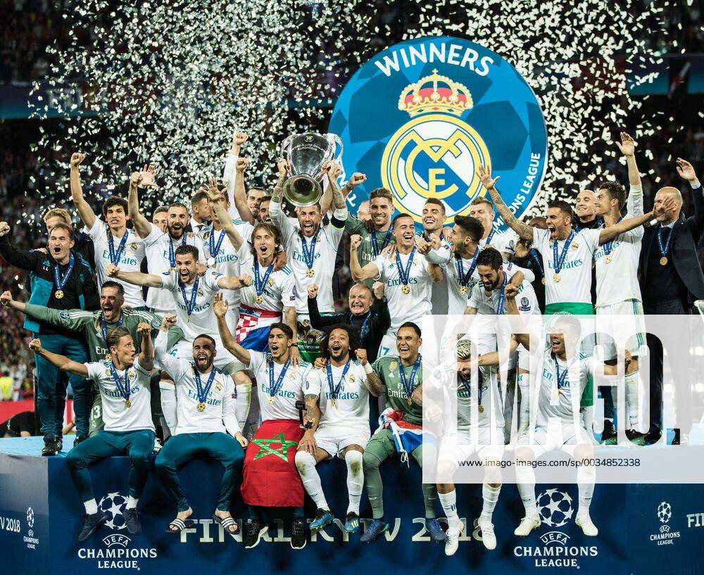 (180527) -- KIEV, May 27, 2018 -- Sergio Ramos (C) of Real Madrid holds the trophy after winning the UEFA Champions League final match between Liverpool and Real Madrid in Kiev, Ukraine on May 26, 2018. Real Madrid claimed the title with 3-1. ) (SP)UKRAINE-KIEV-CHAMPIONS LEAGUE-LIVERPOOL-REAL MADRID Wuzhuang