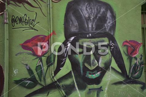 A Mural of Tupac Shakur in Chinatown Alley in San Francisco alley, art, background, chinatown, classic, concept, design, face, famous, male, mural, old, painting, paper, san francisco, texture, traditional, tupac shakur, vintage, wall