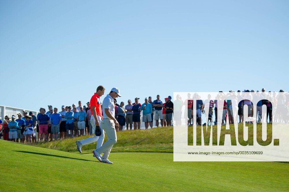 Jordan Spieth from the United States (l.) and Rory McIlroy from Northern Ireland walk on the 10th fairway in the first round of the 118th U.S. Open Championship at Shinnecock Hills Golf Club in Southampton, New York on June 14, 2018. NYP20180614111 COREYxSIPKIN