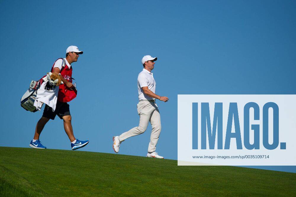 Rory McIlroy from Northern Ireland and caddy Harry Diamond walk on 12th fairway in the first round of the 118th U.S. Open Championship at Shinnecock Hills Golf Club in Southampton, New York on June 14, 2018. NYP20180614126 COREYxSIPKIN