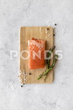 A top view of fresh healthy salted salmon fish on a wooden board salted, salmon, red, fish, food, raw, fresh, top, view, cooking, board, background, healthy, seafood, gourmet, meal, dish, eat, fillet, lunch, wooden, copyspace, salt
