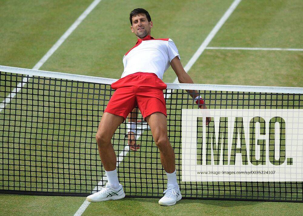 - SPORT Tennis - 2018 Queens Club Fever-Tree Championships - Day Six, Saturday Mens Singles, Semi-Final: Jeremy Chardy (FRA) vs. Novak Djokovic (CRO) Novak Djokovic ,tries to stop himself from touching the net as he arches his back on Centre Court. COLORSPORT ANDREW COWIE
