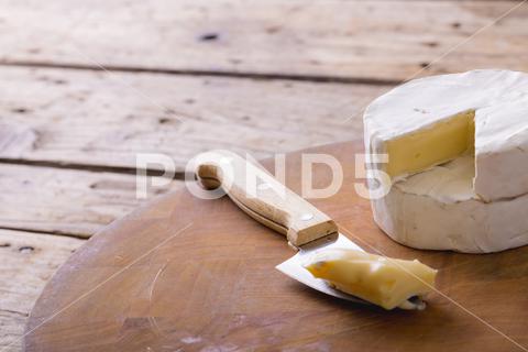 Close-up of brie cheese and knife on board at table, copy space. unaltered, food and dairy product. No People, Close, Brie, Cheese, Knife, Board, Table, Copy Space, Unaltered, Food, Dairy Product, Camembert, Meal, Fresh, Delicious, Wooden, Dinner, Tasty, Healthy, Gourmet, Cooking, Drink, Lunch, Cuisine, Closeup, Organic, Snack, Restaurant, Kitchen, Diet, Ingredient, Copy, Space, Dairy, Product