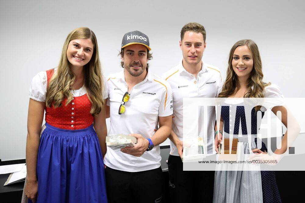 FORMULA 1 - GP of Austria 2018 SPIELBERG,AUSTRIA,29.JUN.18 - MOTORSPORTS, FORMULA 1 - Grand Prix of Austria, Red Bull Ring, free practice. Image shows Fernando Alonso (ESP McLaren) and Stoffel Vandoorne (BEL McLaren) with girls. GEPAxpictures xChristianxWalgram
