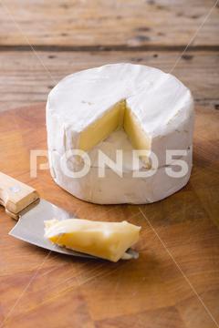 Close-up of brie cheese and knife on wooden board at table, copy space. unaltered, food and dairy product. No People, Close, Brie, Cheese, Knife, Wooden Board, Table, Copy Space, Unaltered, Food, Dairy Product, Camembert, Fresh, Meal, Delicious, Dinner, Tasty, Healthy, Drink, Gourmet, Lunch, Wooden, Cooking, Organic, Cuisine, Closeup, Snack, Restaurant, Diet, Breakfast, Ingredient, Board, Copy, Space, Dairy, Product