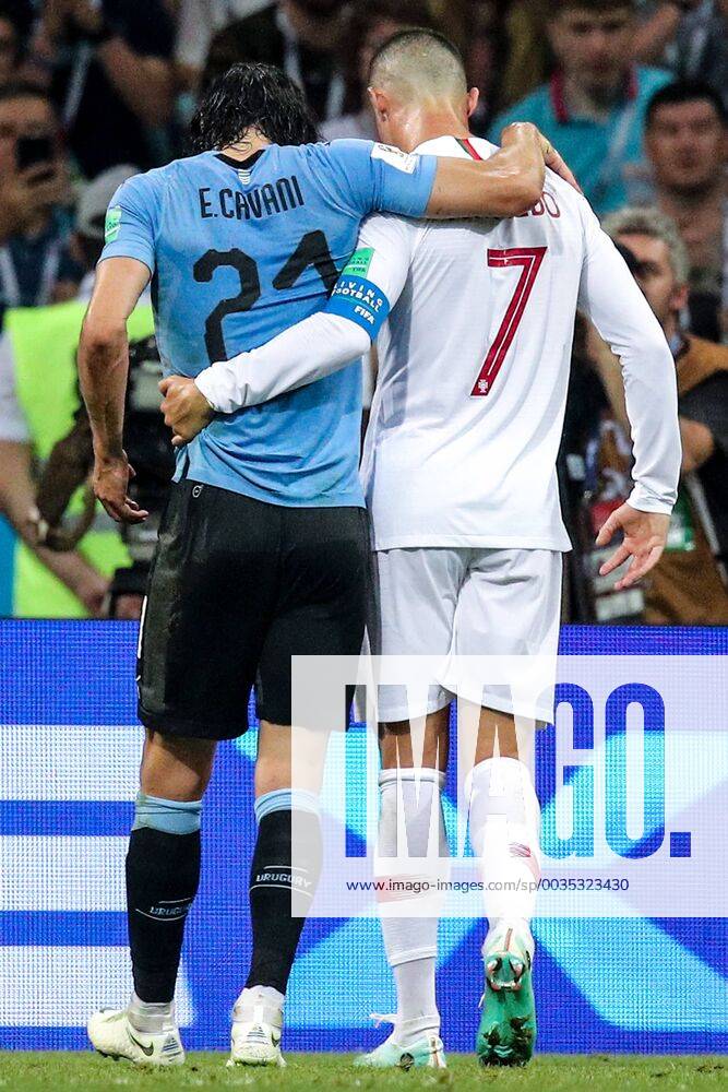 KW26 SOCHI, RUSSIA – JUNE 30, 2018: Portugal s Cristiano Ronaldo (R) helps Uruguay s injured Edinson Cavani off the pitch in their 2018 FIFA World Cup WM Weltmeisterschaft Fussball Round of 16 football at Fisht Stadium. Team Uruguay won the game 2:1. Sergei Bobylev TASS TS0874F8