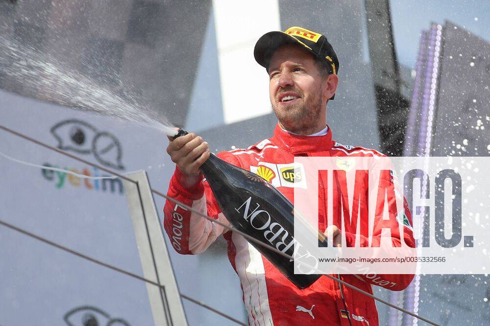 FORMULA 1 - GP of Austria 2018 SPIELBERG,AUSTRIA,01.JUL.18 - MOTORSPORTS - Grand Prix of Austria, Red Bull Ring. Image shows the rejoicing of Sebastian Vettel (GER Ferrari). Keywords: champaign. GEPAxpictures xChristianxWalgram