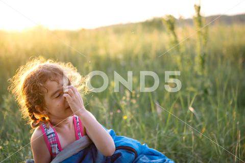 The girl is dissatisfied with scratching mosquito bites, child sleeps in a sleeping bag on the grass in a camping trip. Eco-friendly outdoor recreation, summer time. Sleep disturbance, repellent. girl, dissatisfied, scratching, mosquito, bites, repellent, allergy, summer, sleeping, camping, ache, against allergies, annoying, bite, children, dermatology, discomfort, disease, grabbing, grass, hand, health, insect, Insect bites, irritation, itching, kill, lifestyle, malaria, nature, outdoor, pain, places of bites, protection, recreation, safe, scabies, scratches, adventure, bag, child, childhood, leisure, outside, Sleeping Bag, travel, trip, vacations, weekend, camp