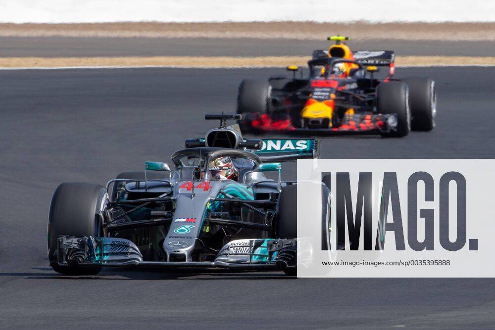 6th July 2018, Silverstone Circuit, Silverstone, England; British Formula One Grand Prix, Friday free practice; Lewis Hamilton in his Mercedes AMG Petronas Motorsport Mercedes F1 W09 ahead of Max Verstappen in his Aston Martin Red Bull Racing Red Bull Racing TAG Heuer RB14 ActionPlus12044448 TimxWilliams