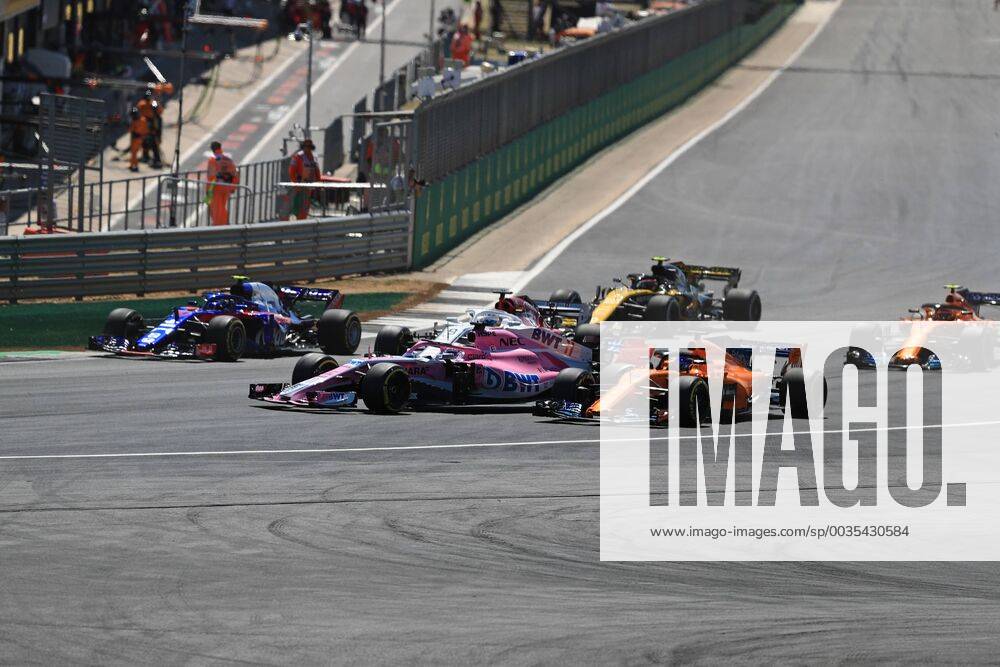 8th July 2018, Silverstone Circuit, Silverstone, England; British Formula One Grand Prix, Race Day; Sahara Force India, Sergio Perez locks up into Turn 1 and comes close to McLaren, Fernando Alonso as they go off the racing line ActionPlus12045471 Octane