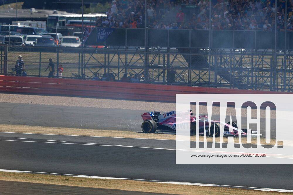 8th July 2018, Silverstone Circuit, Silverstone, England; British Formula One Grand Prix, Race Day; Sahara Force India, Sergio Perez locks up into Turn 1 and demolishes one of the trackside signs ActionPlus12045476 Octane