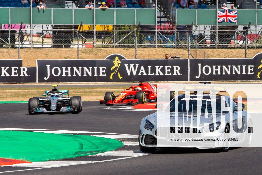 8th July 2018, Silverstone Circuit, Silverstone, England; British Formula One Grand Prix, Race Day; The safety car leads Valtteri Bottas in his Mercedes AMG Petronas Motorsport Mercedes F1 W09 and Sebastian Vettel in his Scuderia Ferrari SF71H ActionPlus12045559 TimxWilliams