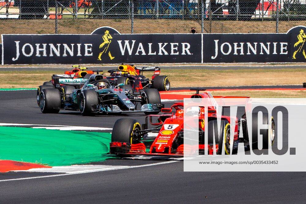 8th July 2018, Silverstone Circuit, Silverstone, England; British Formula One Grand Prix, Race Day; Sebastian Vettel in his Scuderia Ferrari SF71H ahead of Lewis Hamilton in his Mercedes AMG Petronas Motorsport Mercedes F1 W09 ActionPlus12045560 TimxWilliams