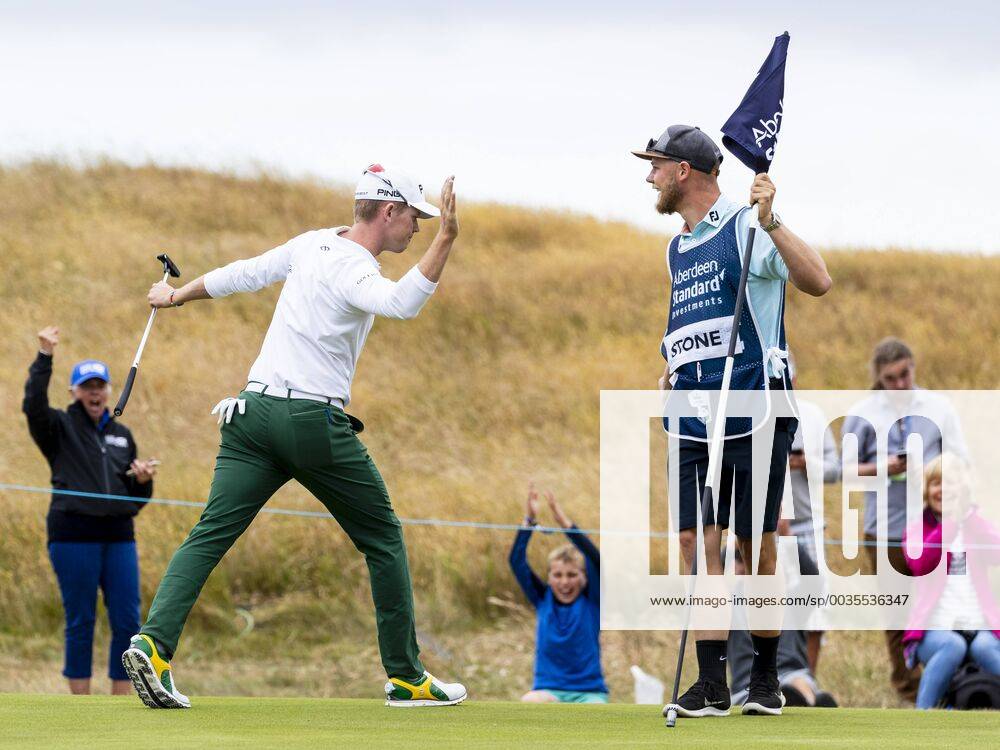 15th July 2018, Gullane Golf Club, Gullane, Scotland; Aberdeen Investments Scottish Open Golf, 4th round; Brandon Stone high five with caddie after eagle putt on the 16th as he headed for a closing round 60 ActionPlus12048145 AlanxRennie
