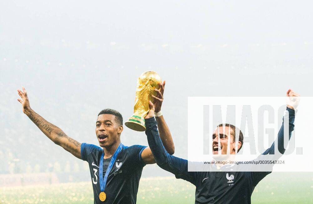 Presnel Kimpembe and Antoine Griezmann of France celebrate with the trophy after winning the FIFA World Cup final match between France and Croatia on July 15, 2018 in Moscow Photo Petter Arvidson BILDBYR N Code PA 92087