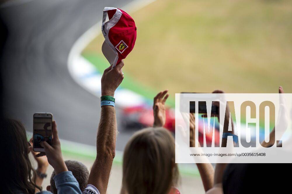 Motorsport Formula 1 Season 2018 2019 Qualifying on Saturday 21 07 2018 at the Hockenheimring in Hockenheim Germany The fans cheer for the pole position as Sebastian Vettel passes by Scuderia Ferrari