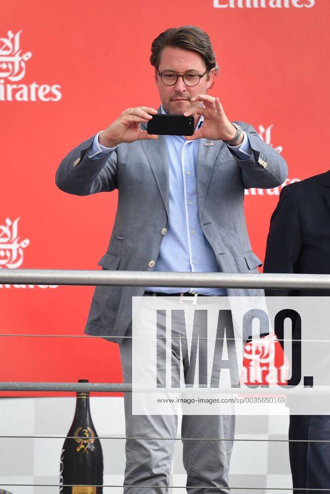 Federal Transport Minister Andreas SCHEUER stands on the podium before the award ceremony and photographs with his smartphone Formula 1 GP of Germany race Hockenheimring season 2018 on 22 07 2018