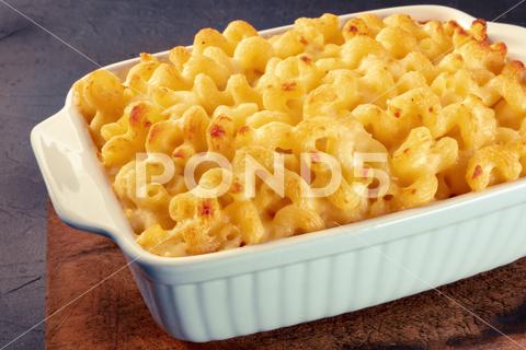 Macaroni and cheese pasta in a casserole, cheesy American dish, baked in the oven cheese, macaroni, mac, pasta, cheesy, casserole, sauce, dish, cheddar, american, gratin, noodle, cream, baked, crunchy, food, table, rustic, wooden, wood, dinner, meal, cuisine, oven, classic, healthy, kid, homemade, gourmet, lunch, parmesan, bake, mozzarella, yellow, pie, recipe, dairy, traditional, comfort