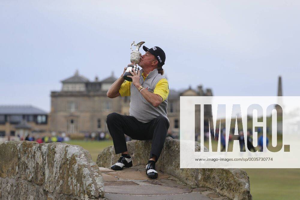 29th July 2018, Old Course at St Andrews, St Andrews, Scotland; The 2018 Senior Open Golf Championships, 4th round; This year s winner Miguel Angel Jimenez (ESP) poses with the Senior Open trophy on the Swilken Bridge on the 18th hole of the Old course ActionPlus12051759 AlanxMartin