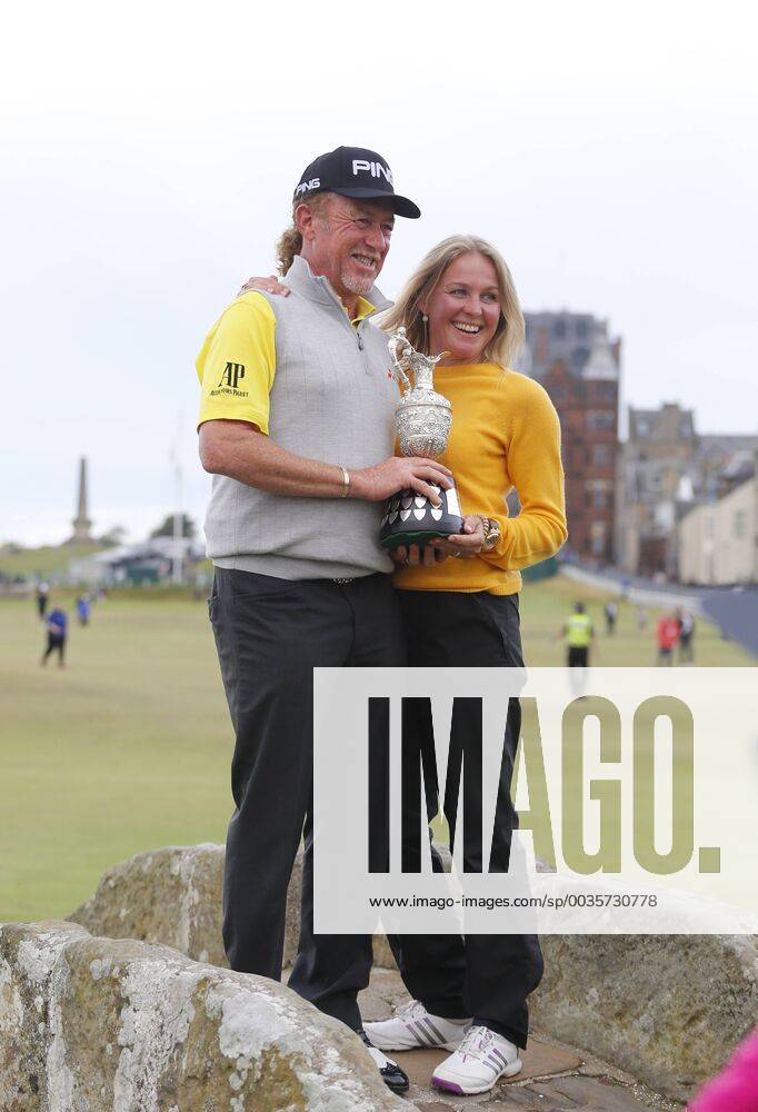 29th July 2018, Old Course at St Andrews, St Andrews, Scotland; The 2018 Senior Open Golf Championships, 4th round; This year s winner Miguel Angel Jimenez (ESP) along with his wife poses with the Senior Open trophy on the Swilken Bridge on the 18th hole of the Old course ActionPlus12051765 AlanxMartin