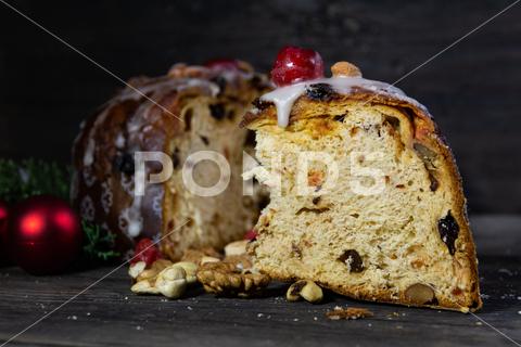 Panettone with fruits and Christmas decorations on the rustic wood almond, baked, bread, breakfast, cake, candied, candle, celebration, chocolate, christianity, christmas, christmas cake, christmas tree, cinnamon, close-up, cocoa, dark, decoration, defocused, dessert, dried, dried fruit, festive, food, fruit, fruitcake, grain, holiday, homemade, icing, illuminated, italian, italian culture, italian food, milan, new, panetone, panettone, pastry, pine cone, raisin, rustic, sliced, sugar, sweet, sweet bread, sweet food, table, tradition, year