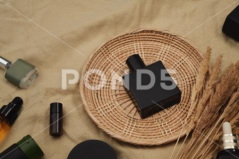 Mockup of fragrance perfume bottle on round rattan basket. Products design and branding concept. product, package, cosmetic, bodycare, make-up, skin care, beauty, bottle, skin, treatment, container, organic, spa, advertising, lotion, moisturizer, skincare, liquid, luxury, plastic, hygiene, mockup, packaging, realistic, copy space, minimal, gel, composition, facial, healthy lifestyle, advertisement, horizontal, serum, body care, transparent, makeup, medical, mock up, poster, presentation, oil, moisturizing, trend, refreshing, marketing, shampoo, pump, moisturize, trendy