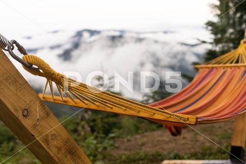 Empty hammok hanging in the mountains in summer. background, beach, tree, water, nature, 3d, relaxation, tourism, travel, hammock, mountain, outdoor, swing, sky, relax, landscape, vacation, hang, idyll, trip, quiet, comfortable, people, outside, forest, field, view, idyllic, panorama, holiday, outdoors, france, break, environment, meadow, harmony, empty, hikers, valley, paradise, alps, enjoyment, feet, green, rendering, adults only, rest, alpine