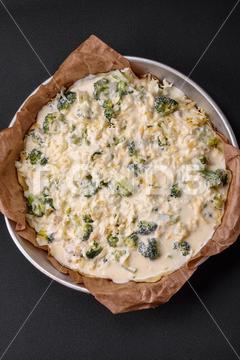 Delicious quiche with broccoli, cheese, chicken, spices and herbs on a dark concrete background broccoli, quiche, food, cheese, vegetable, meal, pie, dinner, crust, lunch, pastry, dish, egg, green, baked, cuisine, tart, snack, homemade, gourmet, french, healthy, kitchen, eating, delicious, breakfast, cooking, cake, fish, cream, table, recipe, traditional, salmon, dough, vegetarian, lorraine, background, rustic, ingredient, spinach, tasty, cooked, appetizer, gratin, wood, organic