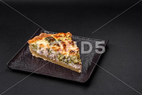 Delicious quiche with broccoli, cheese, chicken, spices and herbs on a dark concrete background broccoli, quiche, food, cheese, vegetable, meal, pie, dinner, crust, lunch, pastry, dish, egg, green, baked, cuisine, tart, snack, homemade, gourmet, french, healthy, kitchen, eating, delicious, breakfast, cooking, cake, fish, cream, table, recipe, traditional, salmon, dough, vegetarian, lorraine, background, rustic, ingredient, spinach, tasty, cooked, appetizer, gratin, wood, organic