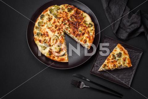 Delicious quiche with broccoli, cheese, chicken, spices and herbs on a dark concrete background broccoli, quiche, food, cheese, vegetable, meal, pie, dinner, crust, lunch, pastry, dish, egg, green, baked, cuisine, tart, snack, homemade, gourmet, french, healthy, kitchen, eating, delicious, breakfast, cooking, cake, fish, cream, table, recipe, traditional, salmon, dough, vegetarian, lorraine, background, rustic, ingredient, spinach, tasty, cooked, appetizer, gratin, wood, organic