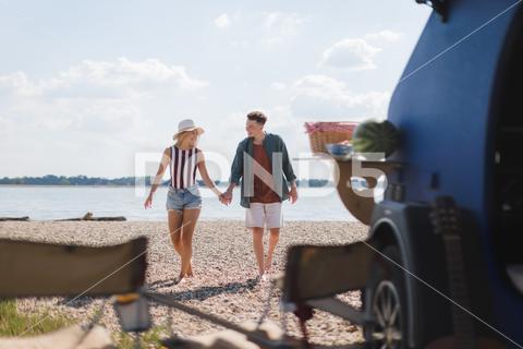 Young couple in front of van during summer holiday. camping, man, woman, van, road trip, smiling, vacation, romance, adventure, outdoors, beach, travel, couple relationship, van vehicle, enjoying, exploration, girlfriend, hipster, joy, lifestyles, outside, relaxed, together, togetherness, trip, camper, dating, explorer, love, sunlight, boyfriend, caucasian, couple, happy, young, holiday, minivan, travel destinations, countryside, sea, millennial generation, motor home, staycation, hat, coast