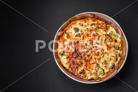 Delicious quiche with broccoli, cheese, chicken, spices and herbs on a dark concrete background broccoli, quiche, food, cheese, vegetable, meal, pie, dinner, crust, lunch, pastry, dish, egg, green, baked, cuisine, tart, snack, homemade, gourmet, french, healthy, kitchen, eating, delicious, breakfast, cooking, cake, fish, cream, table, recipe, traditional, salmon, dough, vegetarian, lorraine, background, rustic, ingredient, spinach, tasty, cooked, appetizer, gratin, wood, organic
