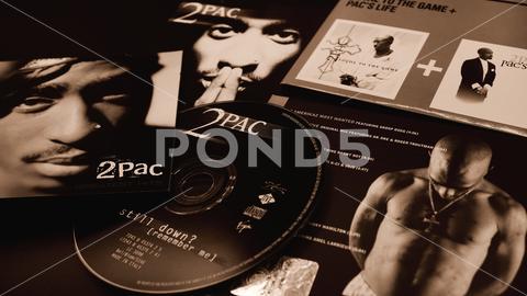 Rome, August 16, 2019: Covers of CDs by Tupac Shakur. also known as 2Pac and Makaveli, her double album, All Eyez on Me, released in 1996 became one of the best-selling albums in the United States actor, arts, celebrities, celebrity, city, concert, creative, culture, entertainment, event, fame, famous, fashion, gangsta rap, glamour, hip hop, hiphop, hollywood, live, music, nightclub, old school, outlaws, outlawz, paramount pictures, people, person, popular, premiere, rap, star, street, style, success, successful, talent, trendy, tupac, tupac shakur, urban, well-known, cd