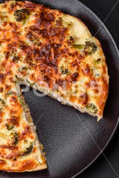 Delicious quiche with broccoli, cheese, chicken, spices and herbs on a dark concrete background broccoli, quiche, food, cheese, vegetable, meal, pie, dinner, crust, lunch, pastry, dish, egg, green, baked, cuisine, tart, snack, homemade, gourmet, french, healthy, kitchen, eating, delicious, breakfast, cooking, cake, fish, cream, table, recipe, traditional, salmon, dough, vegetarian, lorraine, background, rustic, ingredient, spinach, tasty, cooked, appetizer, gratin, wood, organic