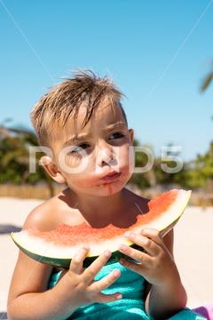 Happy biracial boy eating watermelon by the swimming pool. Spending quality time, lifestyle, childhood, summertime and vacation concept. One Person, Child, Boy, Male, White, People, Happy, Eating, Watermelon, Swimming Pool, Spending, Quality Time, Lifestyle, Childhood, Summertime, Vacation, Concept, Kid, Young, Leisure, Fun, Little, Person, Summer, Holiday, Healthy, Travel, Happiness, Beach, Family, Sea, Beautiful, Sport, Recreation, Cheerful, Biracial, Swimming, Pool, Quality, Time