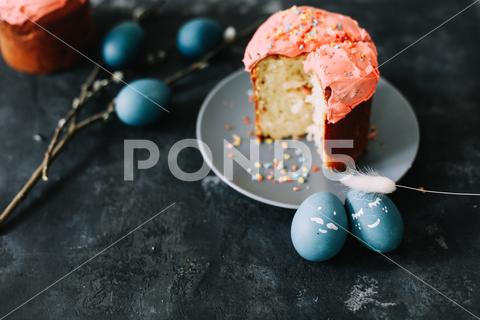 Plate with tasty Easter cake, eggs and willow branches on dark background. High quality photo cake, traditional, egg, branches, symbol, card, pastry, baked, natural, cooking, icing, decor, celebrate, easter eggs, holiday cake, love, willow branches, seasonal, copy space, concept, easter cake, dessert, orthodox, gourmet, decoration, colorful, christian, easter decor, table, sweet, easter decorations, multicolored, homemade, branch, fresh, willow, ribbon, rustic, holiday, decorative, delicious, easter, festive, season, april, pink, blue, springtime, happy