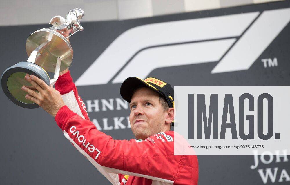 Ferrari s German driver Sebastian Vettel celebrates on the podium after winning the Spa-Francorchamps Formula One Grand Prix of Belgium race, in Spa-Francorchamps, Sunday 26 August 2018. BENOITxDOPPAGNE x05414419x