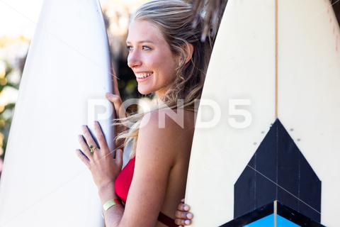 Happy caucasian woman holding surfboard at beach. Spending quality time, lifestyle, friendship, summertime and vacation concept. One Person, Young Adult, Woman, Female, White, People, Happy, Caucasian Woman, Holding, Surfboard, Beach, Spending, Quality Time, Lifestyle, Friendship, Party, Summertime, Vacation, Concept, Young, Sea, Ocean, Person, Fun, Holiday, Leisure, Summer, Coast, Adult, Happiness, Beautiful, Sand, Travel, Smile, Cheerful, Surfer, Water, Together, Caucasian, Quality, Time