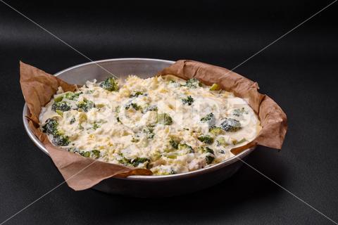 Delicious quiche with broccoli, cheese, chicken, spices and herbs on a dark concrete background broccoli, quiche, food, cheese, vegetable, meal, pie, dinner, crust, lunch, pastry, dish, egg, green, baked, cuisine, tart, snack, homemade, gourmet, french, healthy, kitchen, eating, delicious, breakfast, cooking, cake, fish, cream, table, recipe, traditional, salmon, dough, vegetarian, lorraine, background, rustic, ingredient, spinach, tasty, cooked, appetizer, gratin, wood, organic