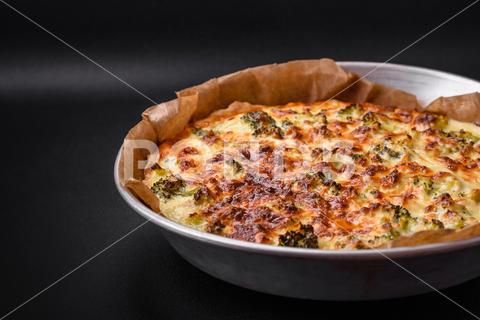 Delicious quiche with broccoli, cheese, chicken, spices and herbs on a dark concrete background broccoli, quiche, food, cheese, vegetable, meal, pie, dinner, crust, lunch, pastry, dish, egg, green, baked, cuisine, tart, snack, homemade, gourmet, french, healthy, kitchen, eating, delicious, breakfast, cooking, cake, fish, cream, table, recipe, traditional, salmon, dough, vegetarian, lorraine, background, rustic, ingredient, spinach, tasty, cooked, appetizer, gratin, wood, organic