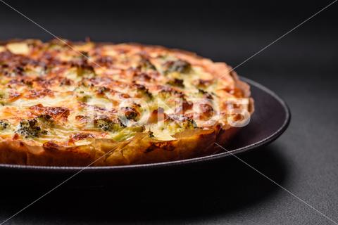 Delicious quiche with broccoli, cheese, chicken, spices and herbs on a dark concrete background broccoli, quiche, food, cheese, vegetable, meal, pie, dinner, crust, lunch, pastry, dish, egg, green, baked, cuisine, tart, snack, homemade, gourmet, french, healthy, kitchen, eating, delicious, breakfast, cooking, cake, fish, cream, table, recipe, traditional, salmon, dough, vegetarian, lorraine, background, rustic, ingredient, spinach, tasty, cooked, appetizer, gratin, wood, organic