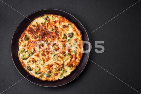 Delicious quiche with broccoli, cheese, chicken, spices and herbs on a dark concrete background broccoli, quiche, food, cheese, vegetable, meal, pie, dinner, crust, lunch, pastry, dish, egg, green, baked, cuisine, tart, snack, homemade, gourmet, french, healthy, kitchen, eating, delicious, breakfast, cooking, cake, fish, cream, table, recipe, traditional, salmon, dough, vegetarian, lorraine, background, rustic, ingredient, spinach, tasty, cooked, appetizer, gratin, wood, organic