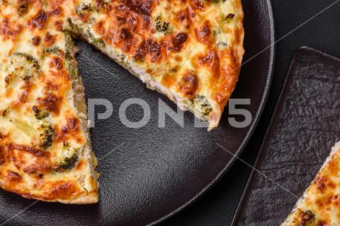 Delicious quiche with broccoli, cheese, chicken, spices and herbs on a dark concrete background broccoli, quiche, food, cheese, vegetable, meal, pie, dinner, crust, lunch, pastry, dish, egg, green, baked, cuisine, tart, snack, homemade, gourmet, french, healthy, kitchen, eating, delicious, breakfast, cooking, cake, fish, cream, table, recipe, traditional, salmon, dough, vegetarian, lorraine, background, rustic, ingredient, spinach, tasty, cooked, appetizer, gratin, wood, organic