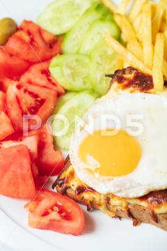 Breakfast. French cuisine. Croque madame sandwich close up on the table. High quality photo bread, cheese, croque, egg, food, french, fried, ham, madame, sandwich, breakfast, cuisine, hot, meal, white, background, baked, crust, delicious, fresh, grilled, snack, toast, traditional, yolk, bechamel, classic, closeup, croque-madame, dinner, dish, fast, fried egg, homemade, lettuce, lunch, melted, sauce, toasted, plate, bechamel sauce, cheddar, cooking, layered, rustic, served, wooden, yellow, monsieur, above