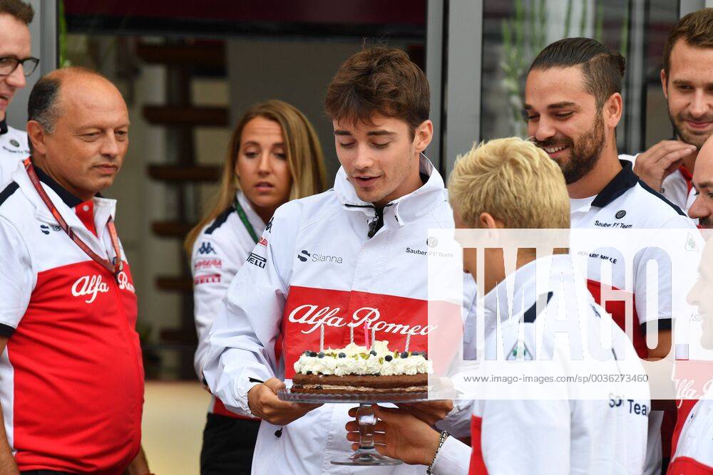 Left Charles Leclerc Alfa Romeo Sauber F1 Team passes birthday cake to Marcus Ericsson Alfa Romeo Sauber F1 Team Italian Grand Prix Renntag 02 09 2018 ITA Italian Grand Prix 02 09 2018 Monza