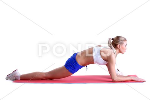 Sporty woman doing stretching exercises on mat, isolated over white background woman, fitness, aerobics, caucasian, isolated, white, adult, mat, healthy, young, training, body, gym, beauty, health, exercise, attractive, lifestyle, girl, background, pretty, sport, slim, muscular, beautiful, yoga, relax, model, sporty, workout, active, shape, red, blue, blonde